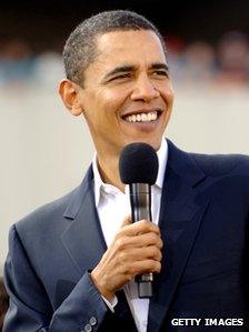 Barack Obama speaking from the stage at a campaign event at the William Bryce Football Stadium on December 9, 2007