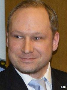 Anders Behring Breivik smiles as he arrives in court in Oslo, 6 February