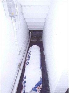 A roll of insulation tape in a recess under the stairs at the IML offices