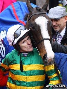 Jockey Tony McCoy celebrates his win on Synchronised