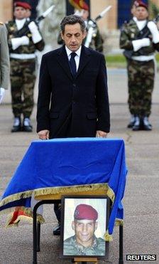 French President Nicolas Sarkozy stands in front of the coffin of Mohamed Legouad in Montauban, 21 March