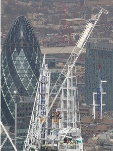 The highest part of the Shard is craned into place