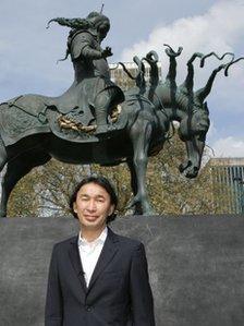 Artist Dashi Namdakov with the statue