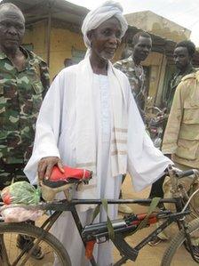 Ibrahim Mohamed Musa with his AK47