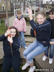 Girl guides playing in the park