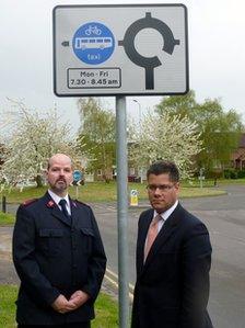 Mr Guest (left) and Alok Sharma MP (Cons) for West Reading (right)outside the bus lane sign