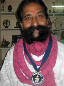 Ram Singh Chauhan with his medal for longest moustache