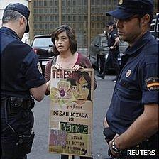 Woman protesting against evictions in Madrid, 14 May 12