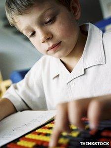 Boy using abacus