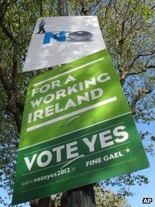 Posters for and against the EU fiscal treaty are attached to a lamppost in Dublin