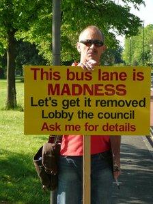 Simon Brooks with sign