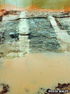 Imprints of the tree trunks which laid the foundations for the building