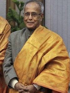 Finance Minister Pranab Mukherjee poses for pictures after the United Progressive Alliance (UPA) meeting in New Delhi on June 15, 2012.