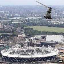 A Royal Air Force helicopter flying over the Olympic Stadium