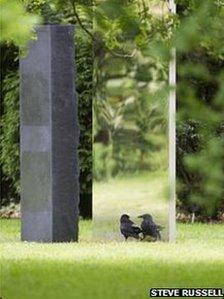 Crow with sculpture