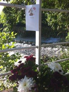 Tributes left to a 14-year-old boy who drowned in the River Avon at Saltford