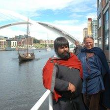 Viking longship and two Norwegian men