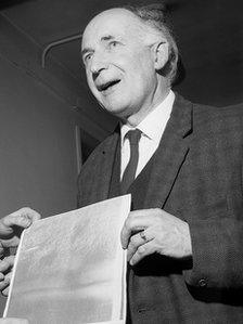 Sir Bernard Lovell holding the first picture of the surface of the moon