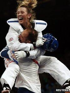 Jade Jones celebrates with her coach