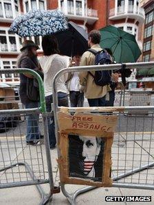 Supporters of Julian Assange, the founder of the Wikileaks website, gather outside the Ecuadorian Embassy