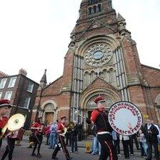 The parade passed by a Catholic Church in north Belfast