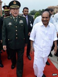 Chinese Defence Minister Liang Guanglie and Indian Defence Minister AK Antony walk after a meeting in Delhi on 4 September 2012