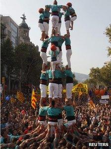 A group of Castellers form a human tower called a "Castell" during a demonstration on Catalan National Day in Barcelona, September 11, 2012.