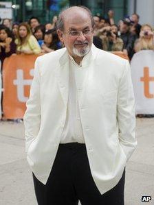 Author Salman Rushdie poses for photographs on the red carpet for the new movie "Midnight"s Children" during the 37th annual Toronto International Film Festival in Toronto on Sunday, Sept. 9, 2012.