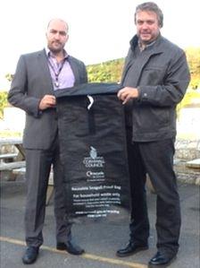 Left to right: Independent councillor Andrew Wallis and cabinet member Steve Double with the new bin sack