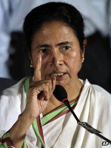 Trinamool Congress party (TMC) leader Mamata Banerjee gestures during a press conference in Kolkata, India, Tuesday, Sept. 18, 2012