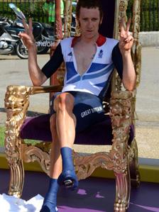 Bradley Wiggins sitting in a victory throne at Hampton Court