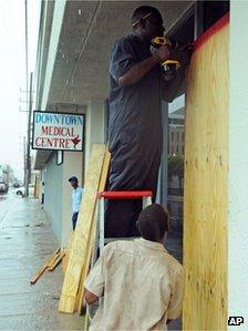 Boarding up windows in the capital Kingston