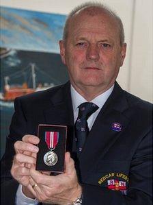 Bob O'Neill with his Queen's Diamond Jubilee medal. Copyright RNLI/Dave Cocks