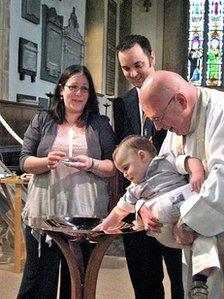Mr Suddards conducting a baptism