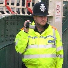 Police officer with video camcorder