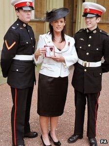 Gillian Molyneux with her sons Jamie and Aaron (right),