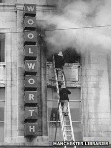 Firefighters tackle the fire at a Woolworth store in Manchester in 1979