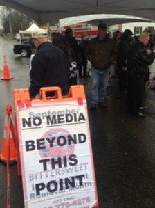 Media hold near the firehouse at Sandy Hook