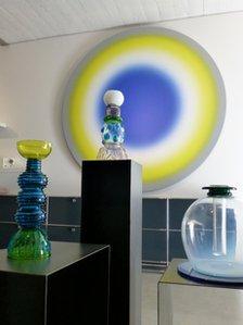 Glassware from the Memphis group, displayed in front of work by Ugo Rondinone, at Simon Studer's gallery