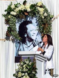 Olivia Harrison, widow of the late ex-Beatle George Harrison, looks skyward following her words to those in attendance for the Ravi Shankar Memorial at the Self Realization Fellowship grounds in Encinitas, California on December 20, 2012.