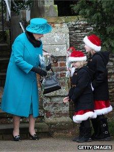 The Queen speaks to two children outside church