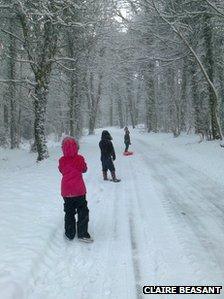 Children playing in snow at Kingham Hill, near Chipping Norton