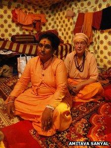 Frenchwoman Sangam Giri sitting behind her guru Aradhana Giri Mai