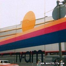 The logo in a mirror opposite the Camden Lock studios