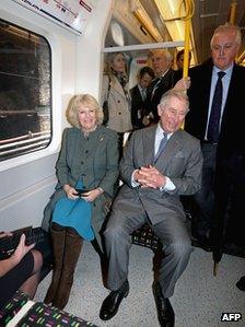 Prince Charles and his wife Camilla, Duchess of Cornwall travel on a Metropolitan underground train