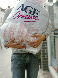 Man carrying Age Concern bundle