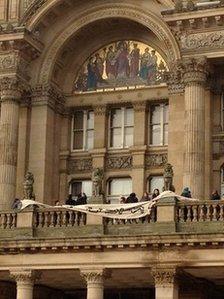 Protestors on the council house balcony