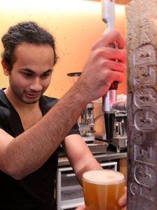 Barman pulling a pint