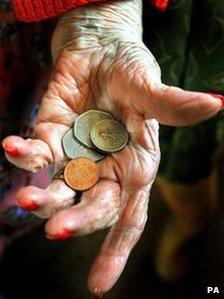 Pensioner holding cash