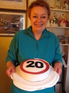 Irene Ralph with a '20' cake